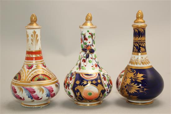 Three Derby porcelain scent bottles and stoppers, early 19th century, 10.5 - 11cm